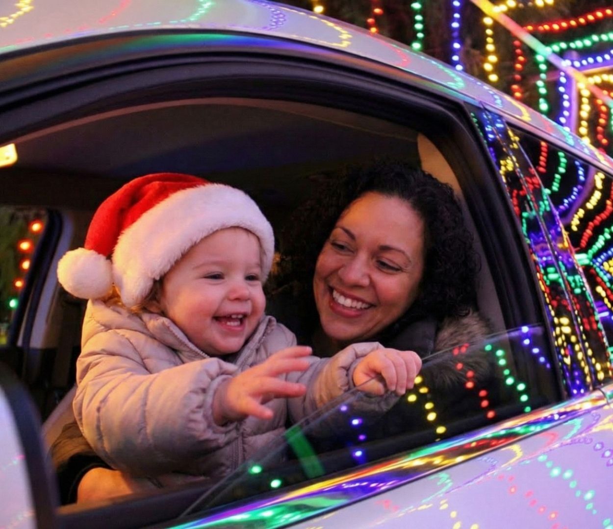 Mother & child enjoying the dazzling lights at the Christmas Carnival of Lights Mother & child enjoying the dazzling lights at the Christmas Carnival of Lights