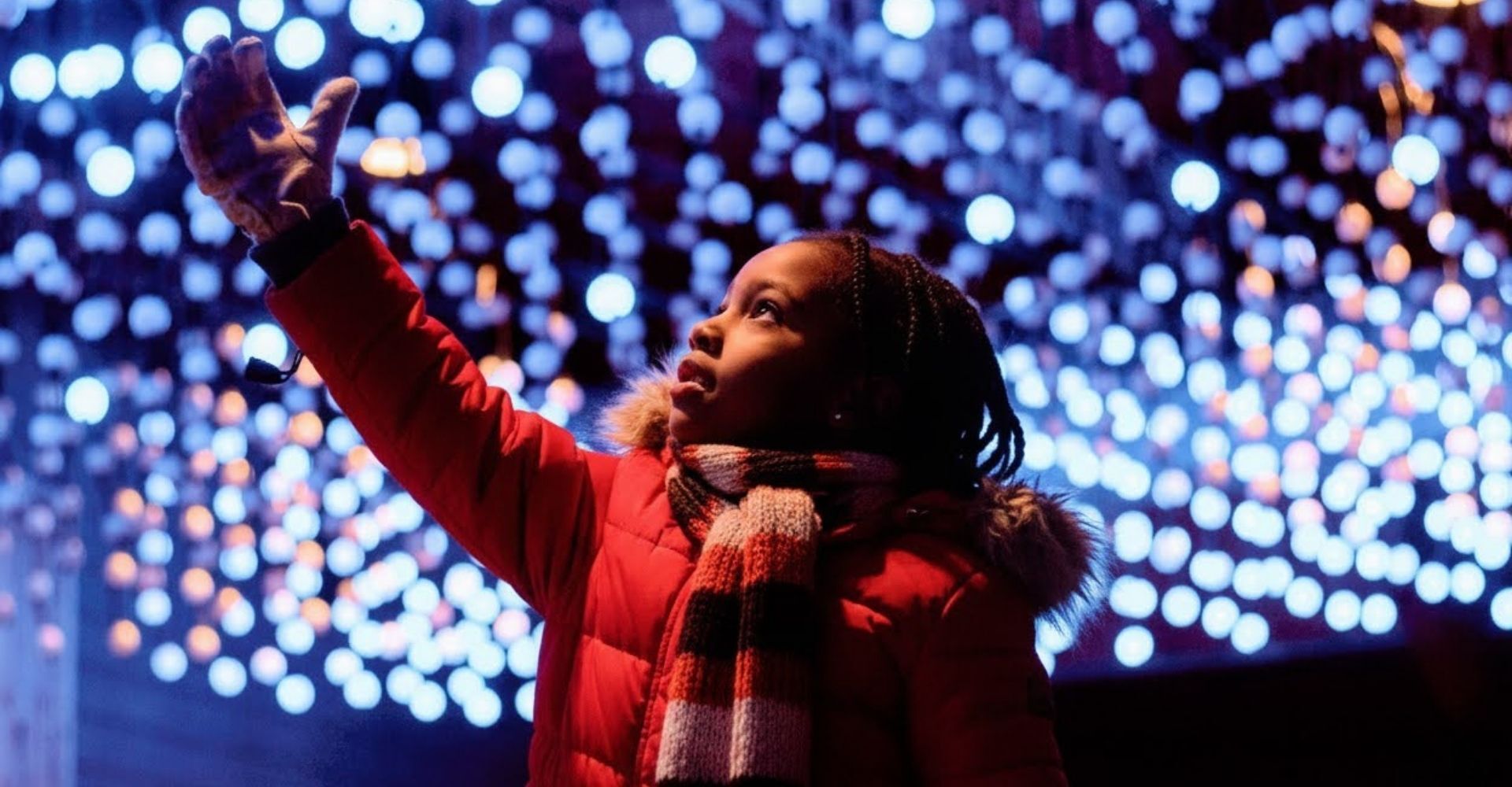 girl enjoying dazzling lights at the Christmas Carnival of Lights girl enjoying dazzling lights at the Christmas Carnival of Lights